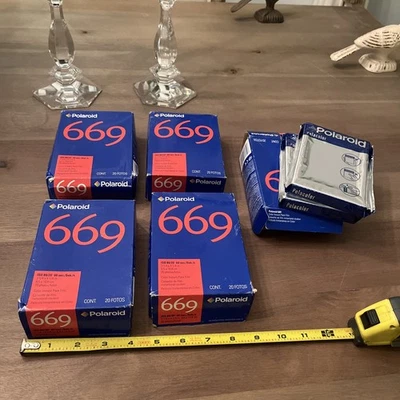 5 boxes of polaroid 669 film, one box open but interior packages intact - Image 1 of 4