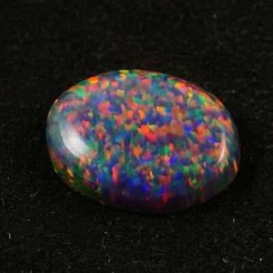 Cabujón ovalado de ópalo de fuego negro 14x10 mm 4 quilates AAA+ piedras preciosas sueltas australianas - Imagen 1 de 4