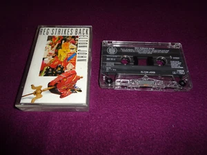 CASSETTE TAPE ‌‌ELTON JOHN / REG STRIKES BACK / ROCKET EUROPE PRESS 1988 - Imagen 1 de 1