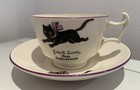 ARCADIAN CUP AND SAUCER CAT GOOD LUCK FROM FELIXSTOWE ANTIQUE