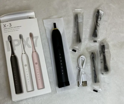 Cepillo de dientes eléctrico sónico, negro, 4 cabezales de cepillo incluidos, nuevo, caja abierta para foto Foto 1 de 3