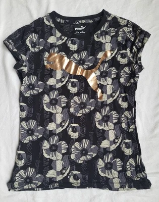 Camisa Puma niña, talla: 12. Mangas de imitación con el logo en el pecho. Reg. Ajuste. Foto 1 de 4