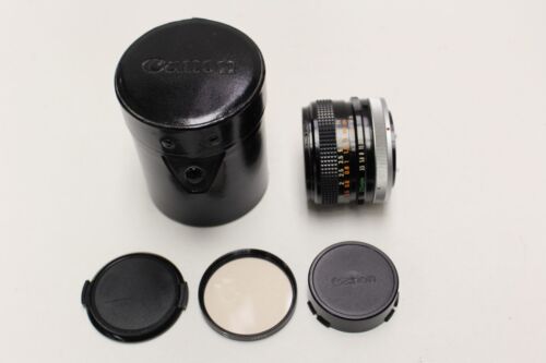 Canon 35mm f3.5 Fd mount manual focus lens with 55mm sky filter, caps and case