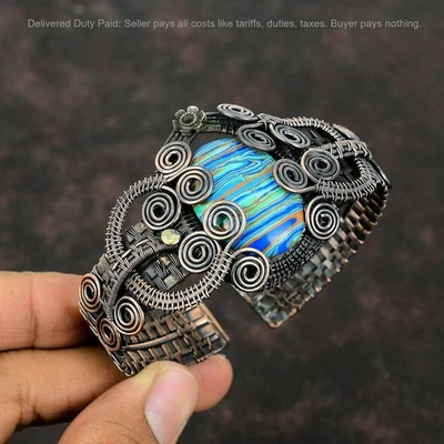 Venta de Navidad Brazalete Ovalado Arco Iris Piedra Calsílice Envuelto Alambre Cobre Foto 1 de 4