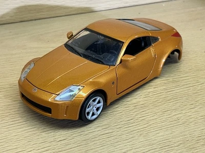 Nissan 350 Z 2003 Maisto - Modelo diecast escala 1/24 para piezas - Naranja metálico Foto 1 de 4