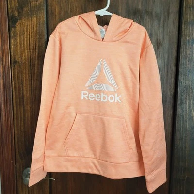 Nuevo Top Sudadera Niñas Reebok Naranja Talla L 10/12 Bolsillos Nuevo Sin Etiquetas Foto 1 de 4