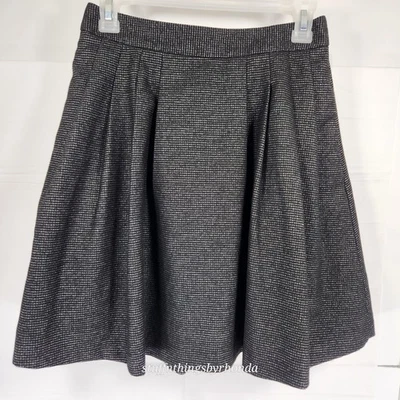 Minifalda Banana Republic negra plisada línea A estilo tweed talla 0 cremallera invisible Foto 1 de 4