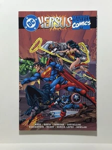 DC COMICS/MARVEL COMICS DC VERSUS MARVEL PAPERBACK NM - Picture 1 of 3