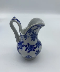 Brocca cremoso floreale blu e bianca 3,5   - Foto 1 di 6