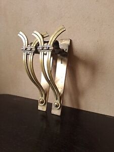A pair of stunning very thick and sturdy Art Nouveau bronze curtain rod holders
