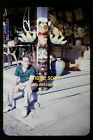 Man with Totem Pole at a Gift Shop in early 1950's, Kodachrome Slide i5a