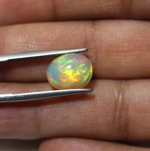 2 Cts 10.7x9 MM Natural AAA Green Yellow Fire Ethiopian Opal Oval Cabochon - Picture 1 of 7