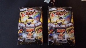 MYSTERY POKEMON: 2 PIKACHU BOXES With 1 IN 3 PSA 10 LOOK FOR PONCHO PIKACHUS - Picture 1 of 6