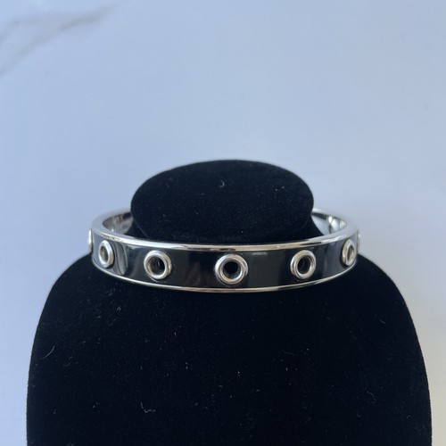 Bracciale Coach tono argento e smalto nero occhielli ��gioielli designer offerte