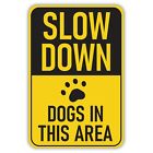 Slow Down Dogs In This Area Aluminum Sign