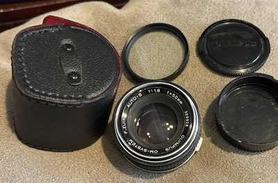 Lente Olympus 50 mm f/1,8 MF sistema OM F.Zuiko OM1 OM2 OM4 con filtro de tapas + estuche Foto 1 de 4