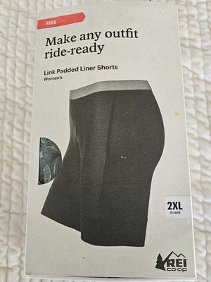 Bermuda acolchoada REI Co-Op nova com etiquetas acolchoada forrada para ciclismo com bolsos tamanho 2XL verde - Imagem 1 de 4