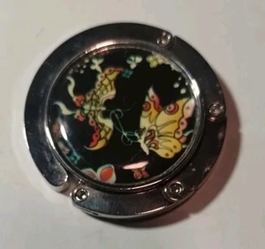 Faltbarer Handtaschenaufhänger Taschenclip Geldbeutelhalter Haken Tisch Bar Aufhänger SCHMETTERLING  - Bild 1 von 4
