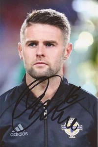 NORTHERN IRELAND & BRIGHTON: OLIVER NORWOOD SIGNED 6x4 ACTION PHOTO+COA - Picture 1 of 1