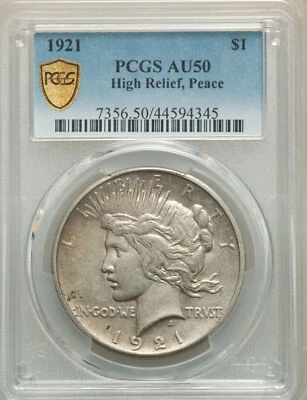 1921 PEACE DOLLAR HIGH RELIEF GRADED AU-50 and HOUSED IN A GOLD SHIELD PCGS HOLD - Image 1 of 2