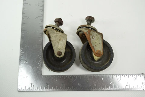 Pair of vintage furniture wheels 2in diameter 7/8in wide ball bearing swivels Cover