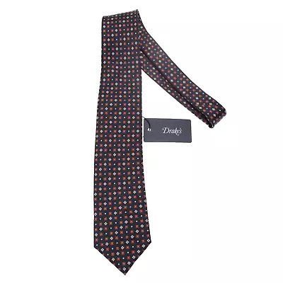 Corbata Drake's nueva con etiquetas azul oscuro con patrón geométrico naranja y blanco 100 % seda Foto 1 de 4