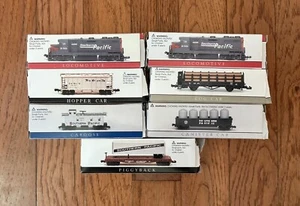 Lote de 7 vagones de tren escala N Pacífico Sur LOCOMOTORA FURGÓN FURGÓN TOLVA DE TRONCOS PIGGY - Imagen 1 de 10
