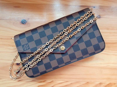 Bolso de lona Louis Vuitton Damier Level versátil usado Foto 1 de 4