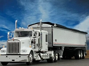 1/64 DCP KENWORTH W900L 60" FLAT TOP W/ WILSON PATRIOT 50' TRI AXLE BELT TRAILER - Picture 1 of 9