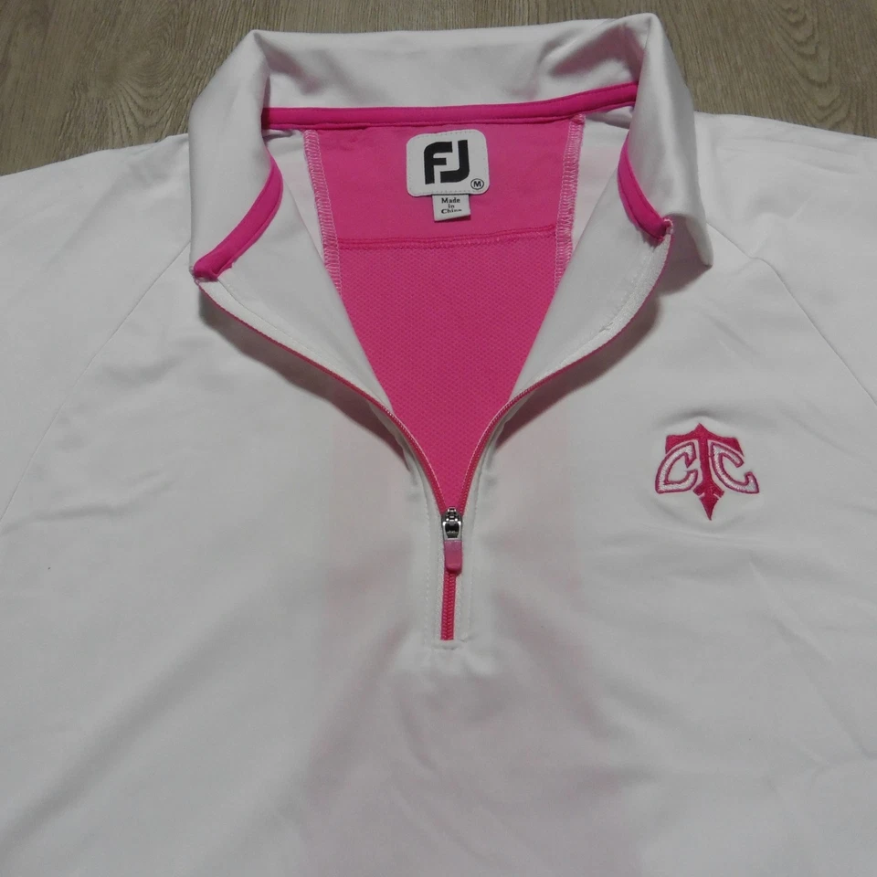 Camisa polo de golf FootJoy para mujer con logotipo M blanca rosa 1/4 cremallera manga con cuello Foto 1 de 4