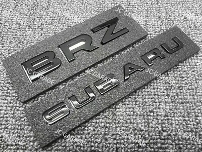 INSIGNIA EMBLEMA MALETERO TRASERO REPUESTO NEGRO BRILLANTE BRZ CALIDAD OEM Foto 1 de 4