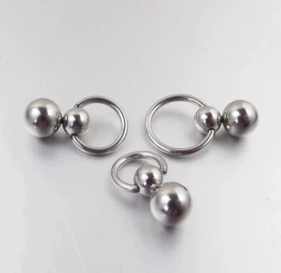 Anillo piercing de labios de pezón PA oreja tragus doble bola de acero inoxidable joyería corporal Foto 1 de 4