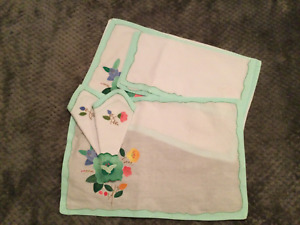 Set of 4 new cotton embroidered placemats and napkins.