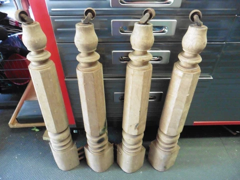 4 vintage wooden table legs with wheels Cover