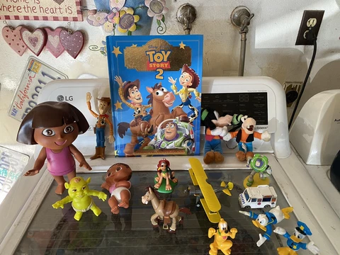 Lot of Disney Toy Story Various Action Figures Lot Woody Buzz Zurg Rex Dora Book Cover
