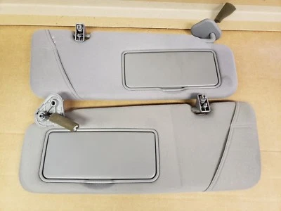 Parasoles izquierdo y derecho Kia Sedona 2002. TELA GRIS ILUMINADA  Foto 1 de 4