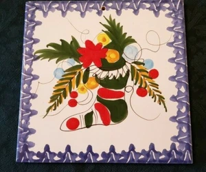 Lovely Ceramic Trivet with a Christmas Stocking, Poinsettia, and Decorations - Picture 1 of 3