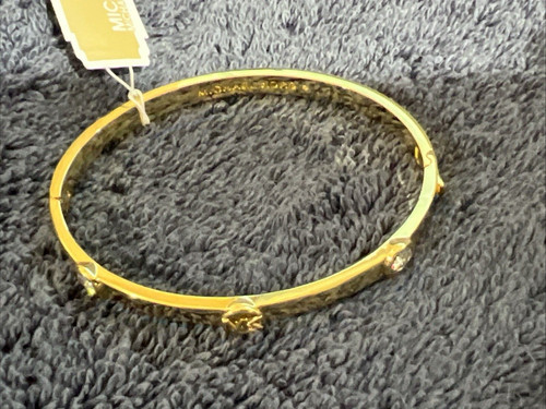 Bracciale donna Michael Kors tono oro con logo in ottone placcato metallo