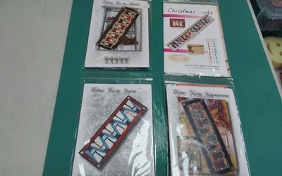 Lot of 4 applique holiday table runner quilt patterns - Image 1 of 4