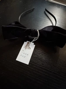NUEVO CON ETIQUETAS - Diadema con lazo negra de metal A New Day - Imagen 1 de 3