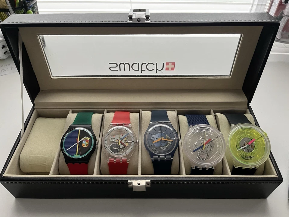 Lote de relojes Swatch con caja de reloj Foto 1 de 4