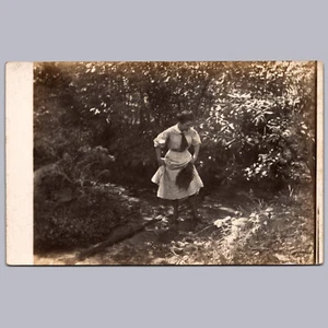 RPPC - Camping/Hunting - Young Woman Crossing Brook - Picture 1 of 3