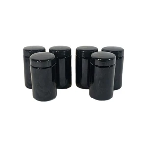 Ein Set aus sechs schwarzen Glasgläsern in Zylinderform mit Deckel - Bild 1 von 4