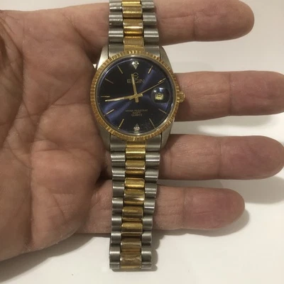 Reloj Elgin Hombre Día Fecha Cuarzo Dos Tonos Dorado Azul Esfera 100 ft Resistente al Agua Foto 1 de 4
