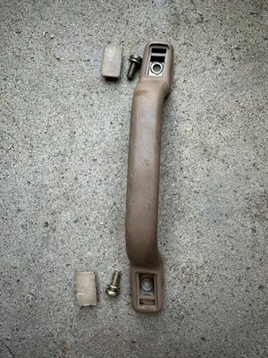 Manija de asistencia de agarre de puerta marrón Toyota Van 1984-1989 con moldura 74603 Foto 1 de 4