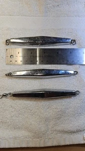 THREE 6 OUNCE DIAMOND JIGS. - Picture 1 of 2