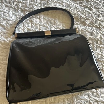 Bolsa de mão década de 1950 por Jana, bolsa vintage preta patenteada com fecho cor prata - Imagem 1 de 4