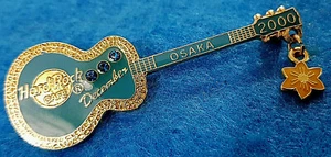 OSAKA *TURQUOISE STONES & NARCISSUS FLOWER BIRTHSTONE GUITAR Hard Rock Cafe PIN - Picture 1 of 1