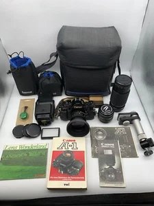 Starter set Canon A1 tanti accessori + 2 obiettivi + BDA + custodia + flash e molto altro - Foto 1 di 24