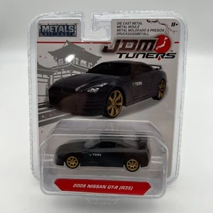 Sintonizadores JDM Jada Toys metal fundido a presión 1/64 2009 Nissan GT-R R35 negro - Imagen 1 de 9